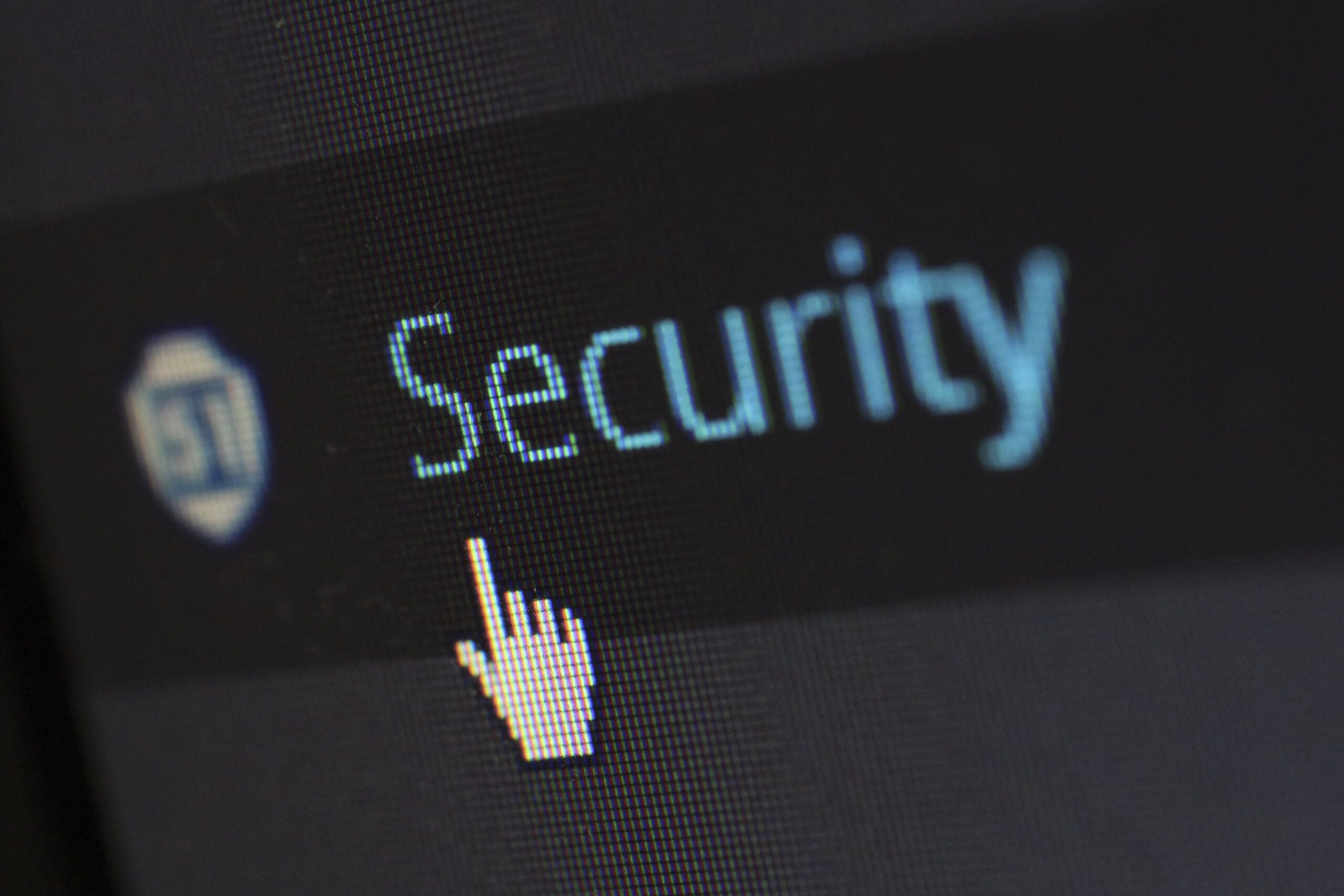 A computer pointer clicking a button labelled 'security'